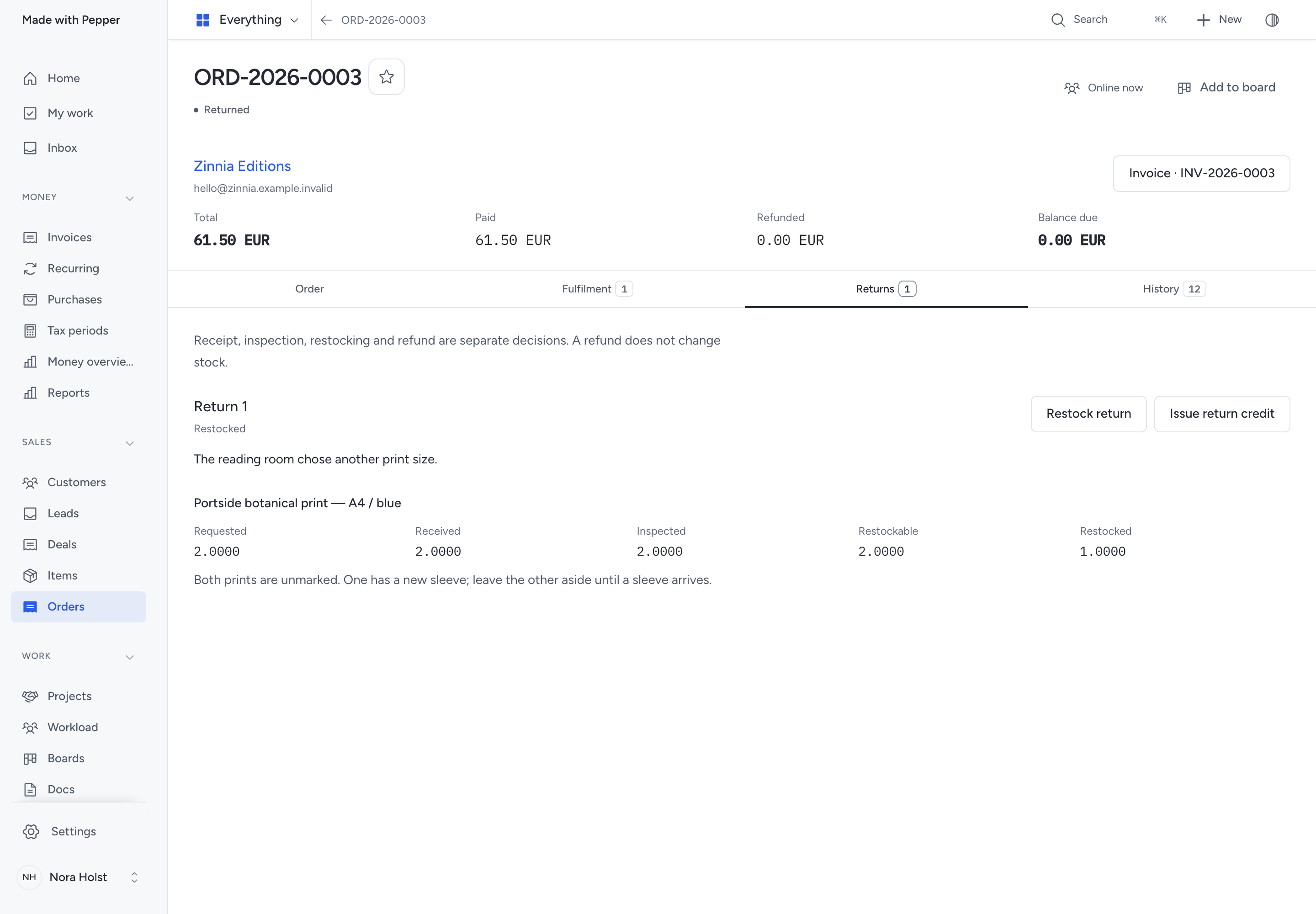 Return record with received and inspected quantities, two restockable prints, one restocked print and no refund