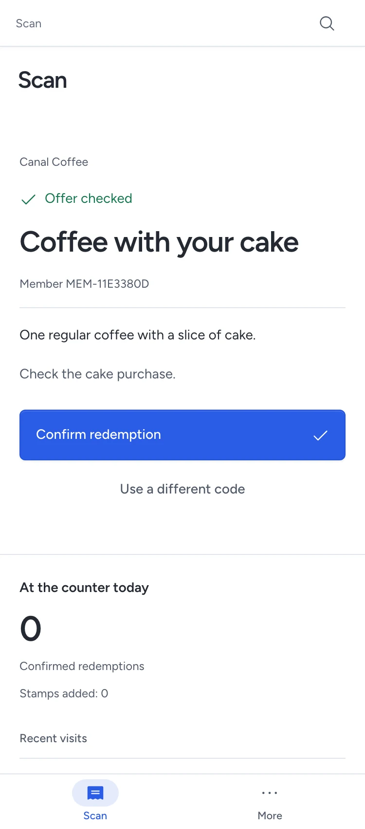 A cashier checks Canal Coffee’s offer before pressing Confirm redemption on a phone